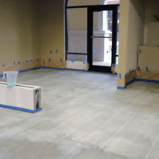 Mapei Primer L being applied to a concrete floor before self-leveling underlayment